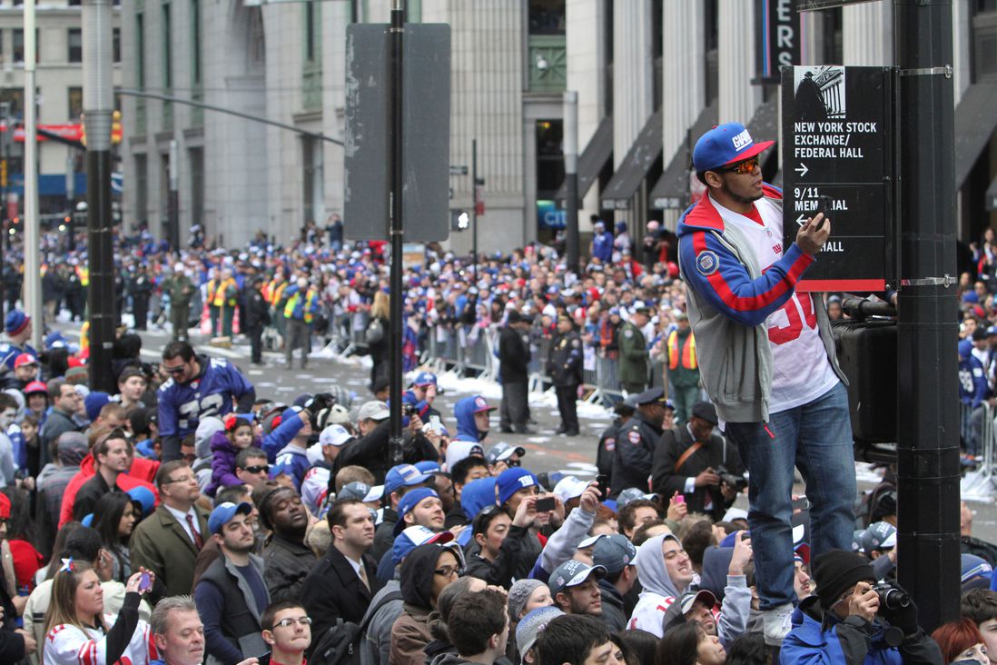 Fans line the street during the 2012 parade for the New York Giants (Mary Altaffer/AP/Shutterstock)